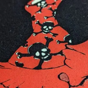 Camiseta Flamenca · Detalle del vestido de Manojito de Claveles